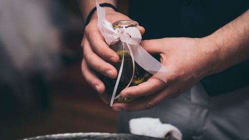 Close-up of man working in glass