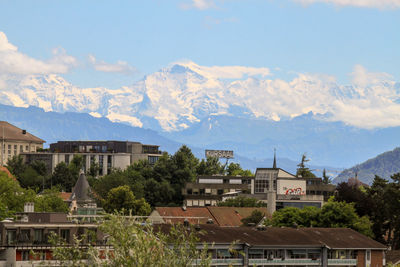 Buildings in town with mountais in the horizon