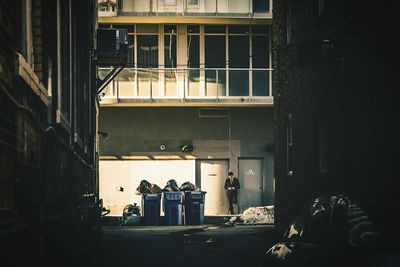 Woman standing in front of building