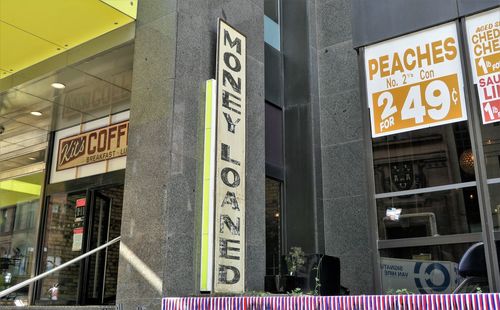 Low angle view of information sign in city