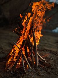 Close-up of bonfire on beach