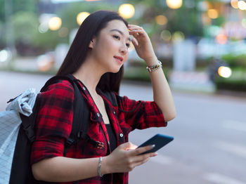 Young woman using mobile phone