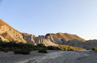 Scenic view of rocky mountains against clear sky