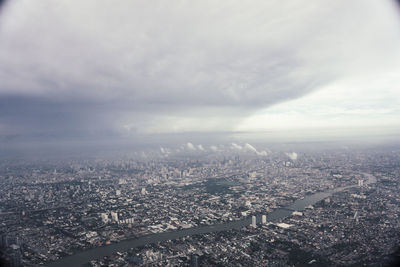 High angle view of city buildings against sky