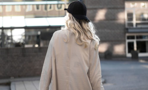 Rear view of woman standing outdoors