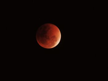Low angle view of moon against sky at night