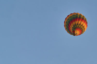 Low angle view of hot air balloon against clear sky