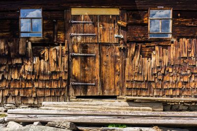Wooden log cabin in old building