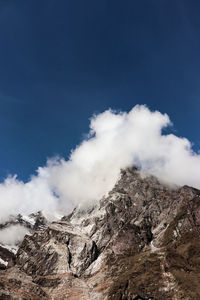 Scenic view of snowcapped mountain against sky