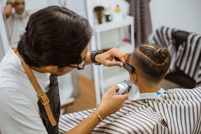 Side view of young woman using mobile phone