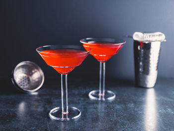 Close-up of wine glasses on table