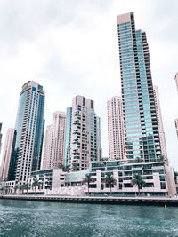 Modern buildings in city against sky