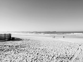 Scenic view of beach against clear sky