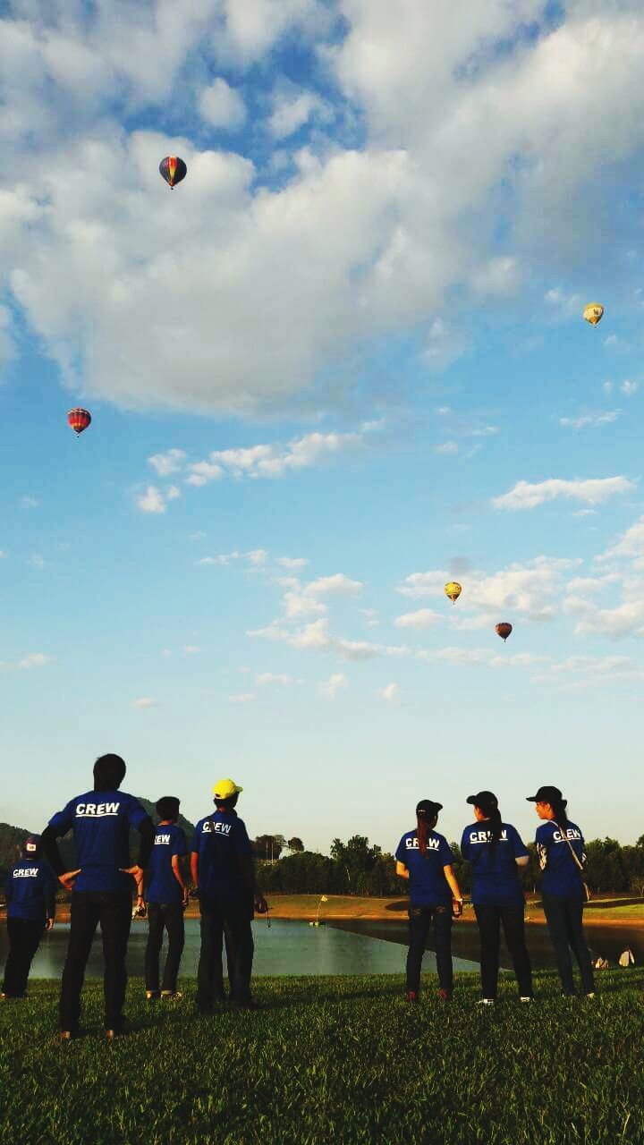 PEOPLE PARAGLIDING IN SKY