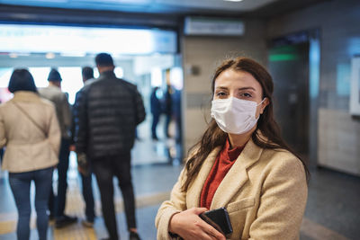 Portrait of woman standing at home