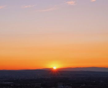 Scenic view of silhouette landscape against romantic sky at sunset