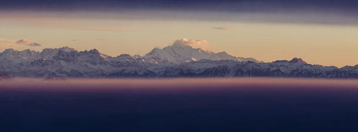 Scenic view of mountains against sky during sunset