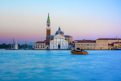 Church of san giorgio maggiore at sunset with the canal grande and the giudecca canal empty 