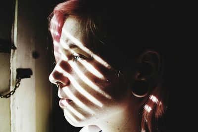 Close-up of thought hipster woman looking away