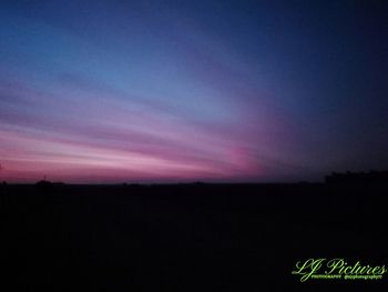 Silhouette landscape against sky at sunset