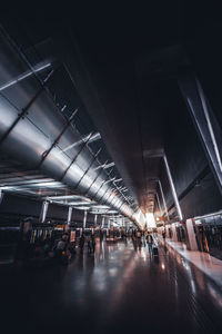 Group of people in illuminated modern building