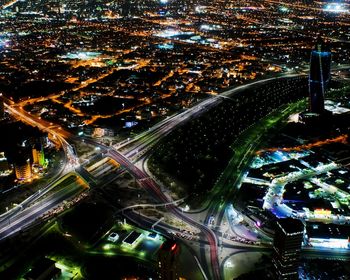 Aerial view of illuminated city at night