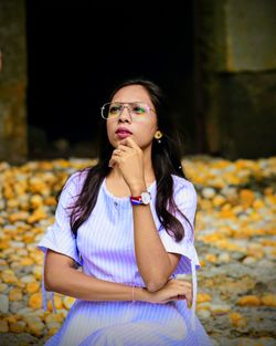 Portrait of a young woman looking away