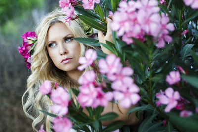 Woman amidst flowering plants