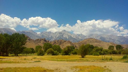 Scenic view of mountains against cloudy sky