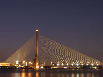 Low angle view of suspension bridge at night
