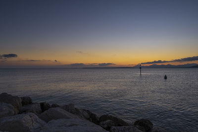 Scenic view of sea against sky during sunset