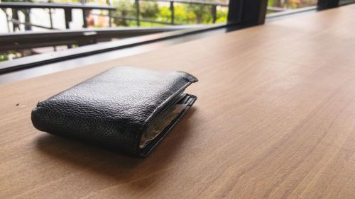 Close-up of wallet on table