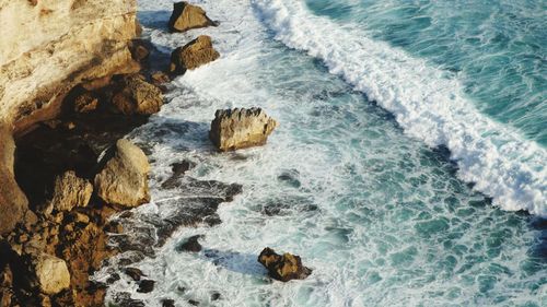 High angle view of rocks in sea