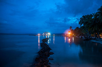 Scenic view of sea against sky at night