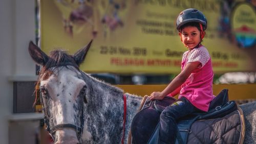 Boy riding horse