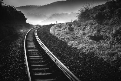 Railroad tracks by mountain