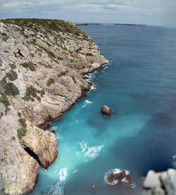 High angle view of rocks in sea