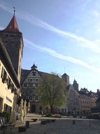 Buildings in city against sky