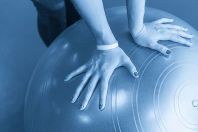Low section of woman exercising in gym