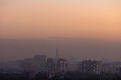 Cityscape against sky during sunset
