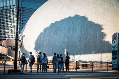Group of people walking in office building