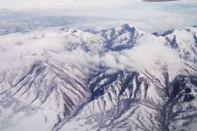 Scenic view of snow covered mountains against sky