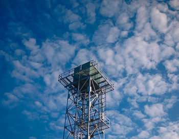 Low angle view of windmill against sky