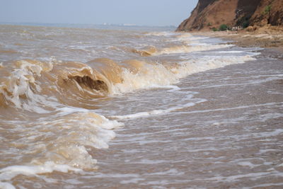 Scenic view of beach against sky