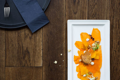 High angle view of fruits in plate on table