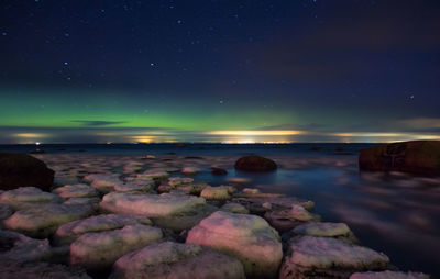 Scenic view of sea against sky at night