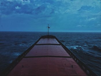 Pier over sea against sky