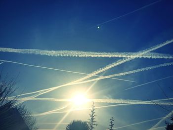 Low angle view of vapor trails in sky