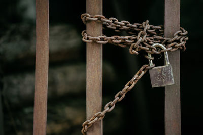 Close-up of padlock on metal fence