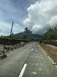 View of road against cloudy sky